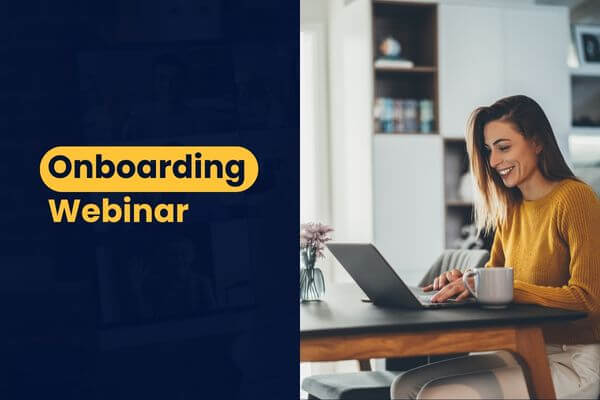 An image showing a smiling woman using a laptop doing onboarding webinar.